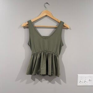 Sage green preplum top with cutout detail